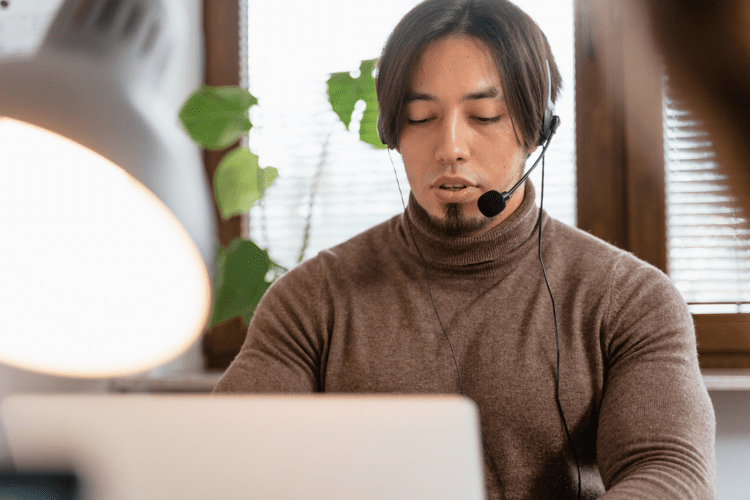 Man using a headset whilst working.