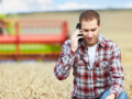Long range DECT Phone shown being used outdoors on farmland.