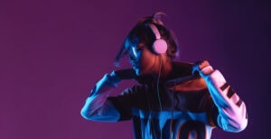 Cool young woman wearing headphones